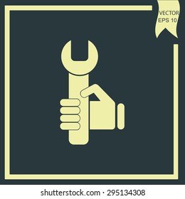 hand holding a wrench icon. Vector illustration