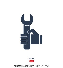 hand holding a wrench icon. Vector illustration