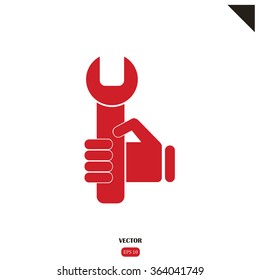 hand holding a wrench icon. Vector illustration