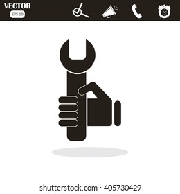 hand holding a wrench icon. Vector illustration