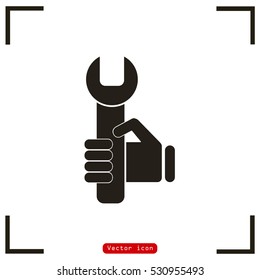 hand holding a wrench icon. Vector illustration