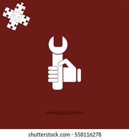 hand holding a wrench icon. Vector illustration
