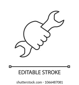 Hand holding wrench linear icon. Thin line illustration. Double open ended spanner. Contour symbol. Vector isolated outline drawing. Editable stroke