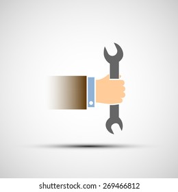 Hand holding a wrench. Vector image.