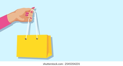 Hand holding a yellow shopping bag against a light blue background. Vector illustration