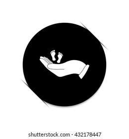 hand holds baby leg -  black vector icon