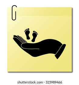 hand holds baby leg - vector icon