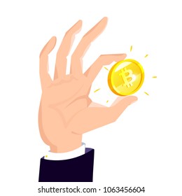 Hand holds bitcoin