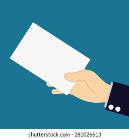 Hand holds blank business card on blue background