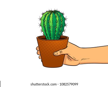 Hand holds cactus pop art retro vector illustration. Isolated image on white background. Comic book style imitation.
