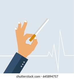 Hand holds cigarette with two fingers, behind vital line, light blue background