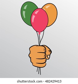 Hand holds colorful balloons isolated