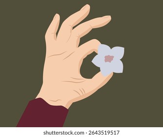 A hand holds a delicate flower. The theme is about nature, femininity, harmony and mindfulness of the moment. EPS 10.