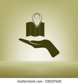 Hand holds folded paper map