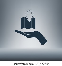 Hand holds folded paper map