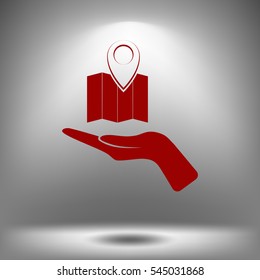 Hand holds folded paper map