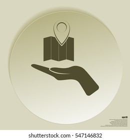 Hand holds folded paper map