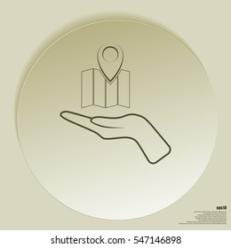 Hand holds folded paper map