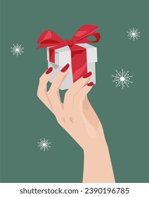 The hand holds a gift for Christmas or New Year. vector illustration of the gift. Box with red ribbon on a green background with snowflakes. A woman's hand with red manicure. The girl gives a gift