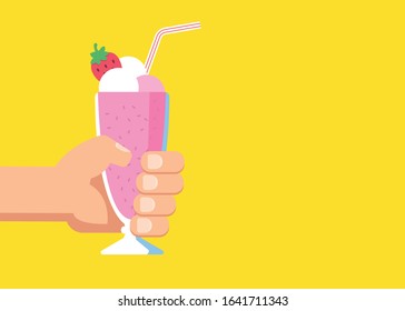 Hand Holds a Glass with a Milkshake with a Cream