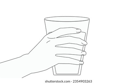 The hand holds a glass of water. Health . beauty. nature.