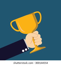 Hand holds goblet of winner on blue background