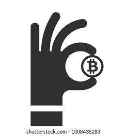 Hand holds a gold coin bitcoin. The symbol is Ok; BTC flat icon