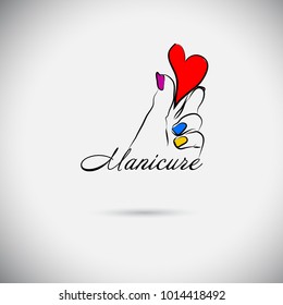 The hand holds the heart. Beautiful manicure
