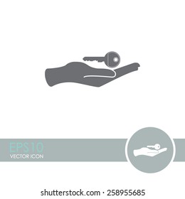 Hand holds home keys vector icon.