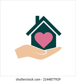 Hand holds house with heart icon, healthcare on white background, care and charity business concept