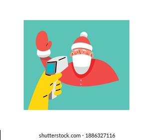 A hand holds an infrared thermometer to measure temperature. Santa Claus in a surgical mask protecting from the virus. Santa on the temperature check.