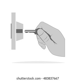 Hand holds a key isolated on background