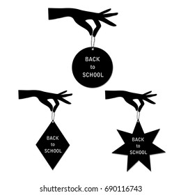 Hand holds label back to school.Vector illustration