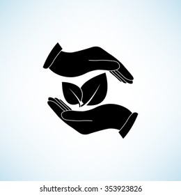 hand holds leaves -  black vector icon