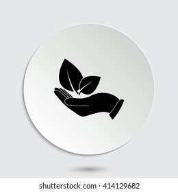 hand holds leaves - black vector icon  with shadow