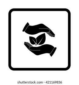 hand holds leaves -  black vector icon