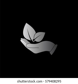 hand holds leaves  - black vector icon
