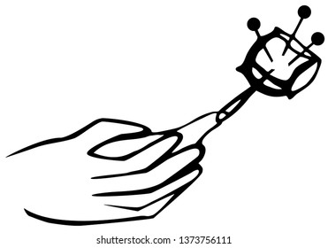 Hand holds a needle with thread. For sewing design