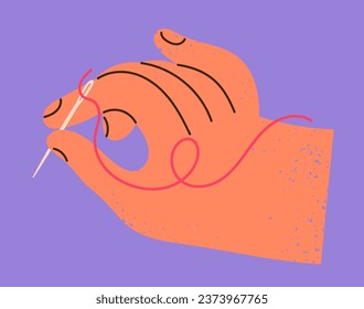 Hand holds the needle and thread and sews