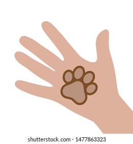 Hand holds paw dogs. Animal protection on a white background.