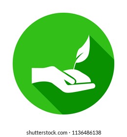 the hand holds the plant green icon in Badge style with shadow  on white background