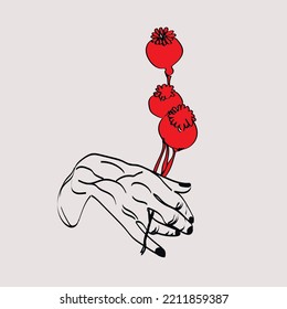 The hand holds the poppy red