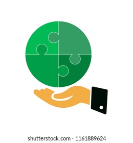 The hand holds puzzle pieces. Vector image. Flat design.