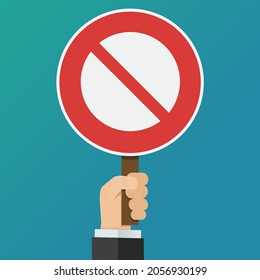 A hand holds up a round prohibition sign on a blue background (flat design)