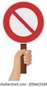 A hand holds up a round red crossed out prohibition sign (cut out)