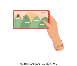 A hand holds a smartphone displaying a mobile game. The user interacts with the phone using fingers to tap on the screen. This digital device supports gameplay and entertainment, showcasing modern