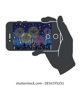 A hand holds a smartphone horizontally, displaying a vibrant fireworks display over a city skyline at night.