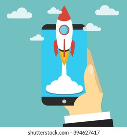 Hand holds smartphone with launch rocket. Startup concept. Flat vector illustration.