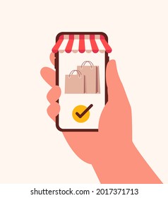 Hand holds smartphone with online store and paper bags on screen. Concept online shopping vector illustration