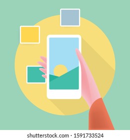 Hand holds smartphone with photos icon on smartphone screen. Multimedia, photo album app concept. Modern simple flat design for web banners, web site, infographics. Creative vector illustration
